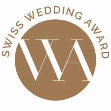 Swiss Wedding Award logo with large white WA letters on a brown circle, text arched above - perfect for a wedding singer in Switzerland or Zurich.
